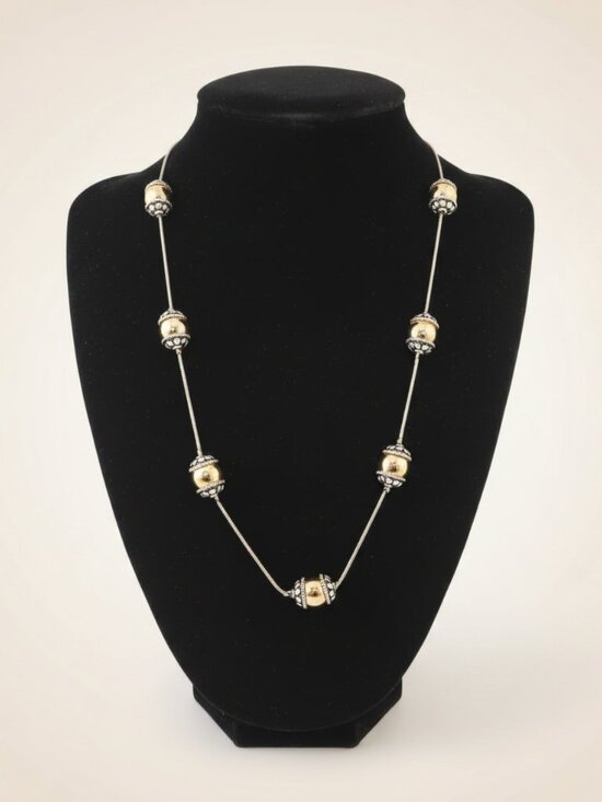 Jewelry - Silver-toned necklace accented by golden and silver spherical beads. Brand new.